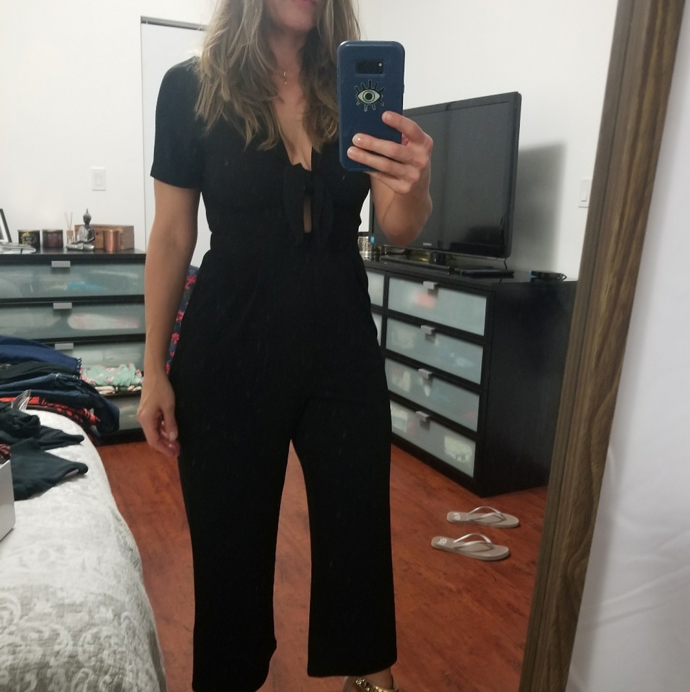 Black  jumpsuit size 4. Brand Express . NWOY